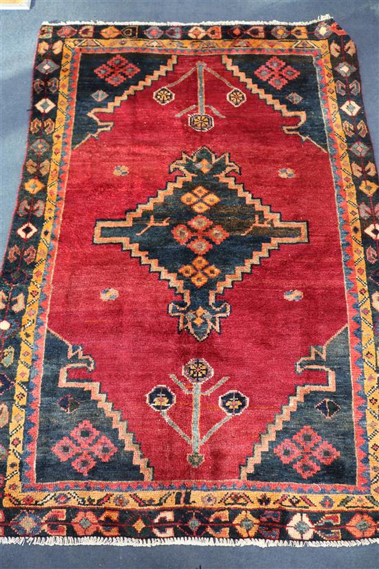 A Hamadan red ground rug, 5ft 8in by 3ft 10in.